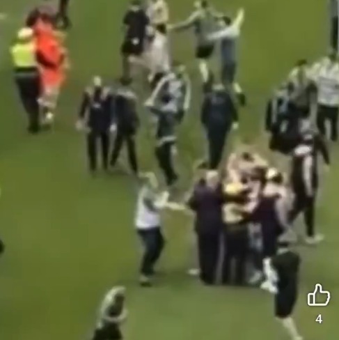 Moment Hearts star ‘stamps on Celtic pitch invader’s phone after being confronted by yob in chaotic scenes’