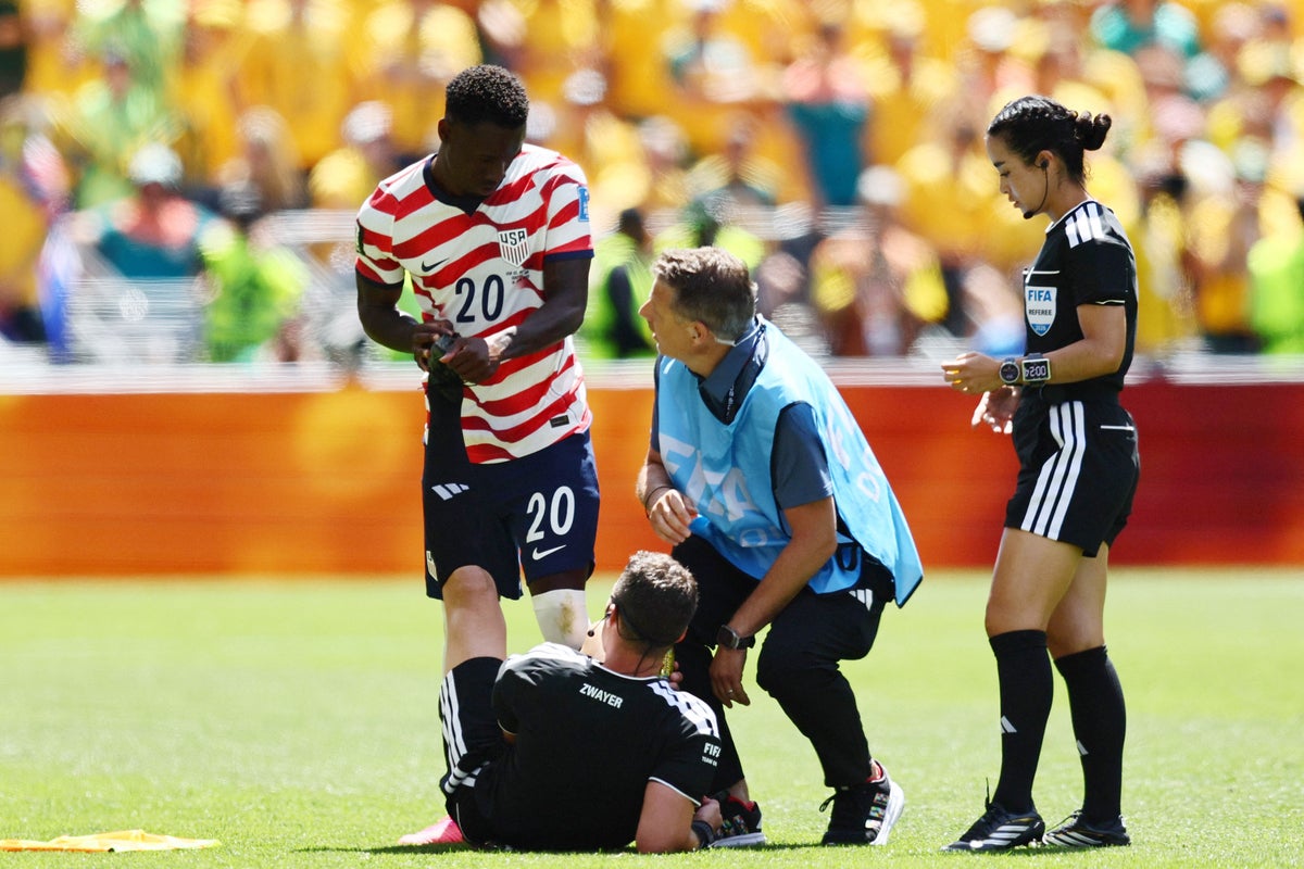 USA v Australia referee Felix Zwayer pulls up with cramp towards end of World Cup match